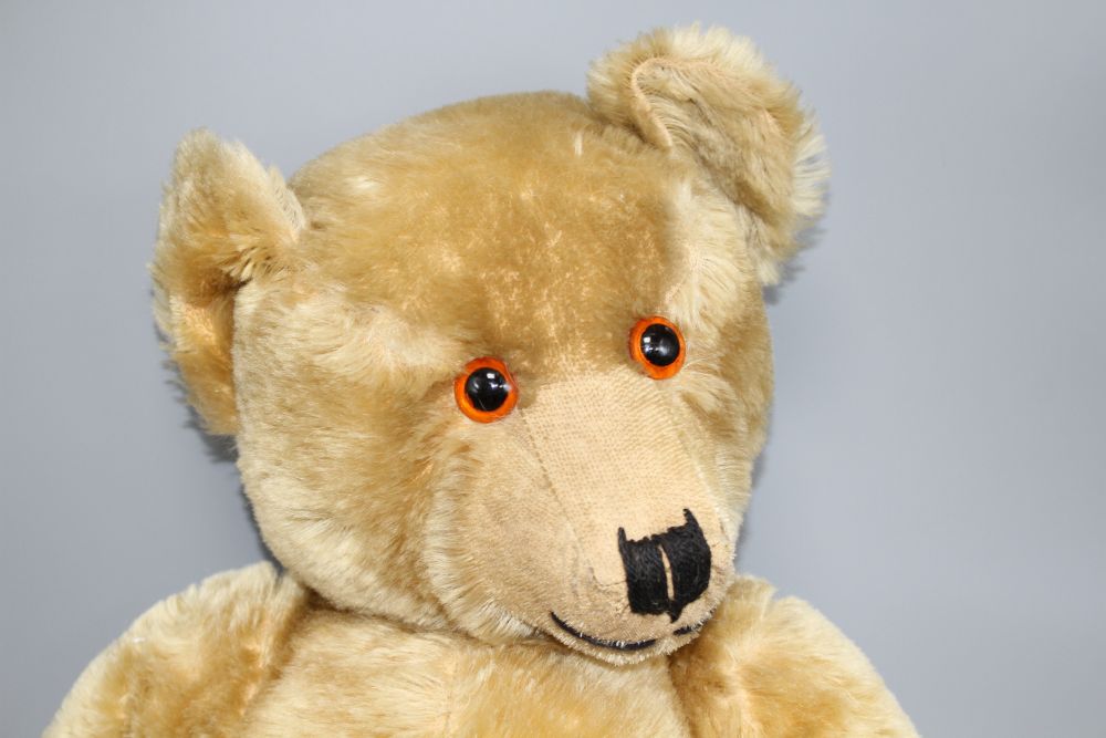 A Chiltern Hugmee 1930s bear, 25in., velvet pads, bald patch back of both legs and also back of neck